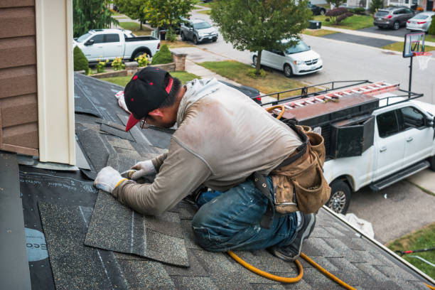 Professional Roofing technician working in Lenox, IA